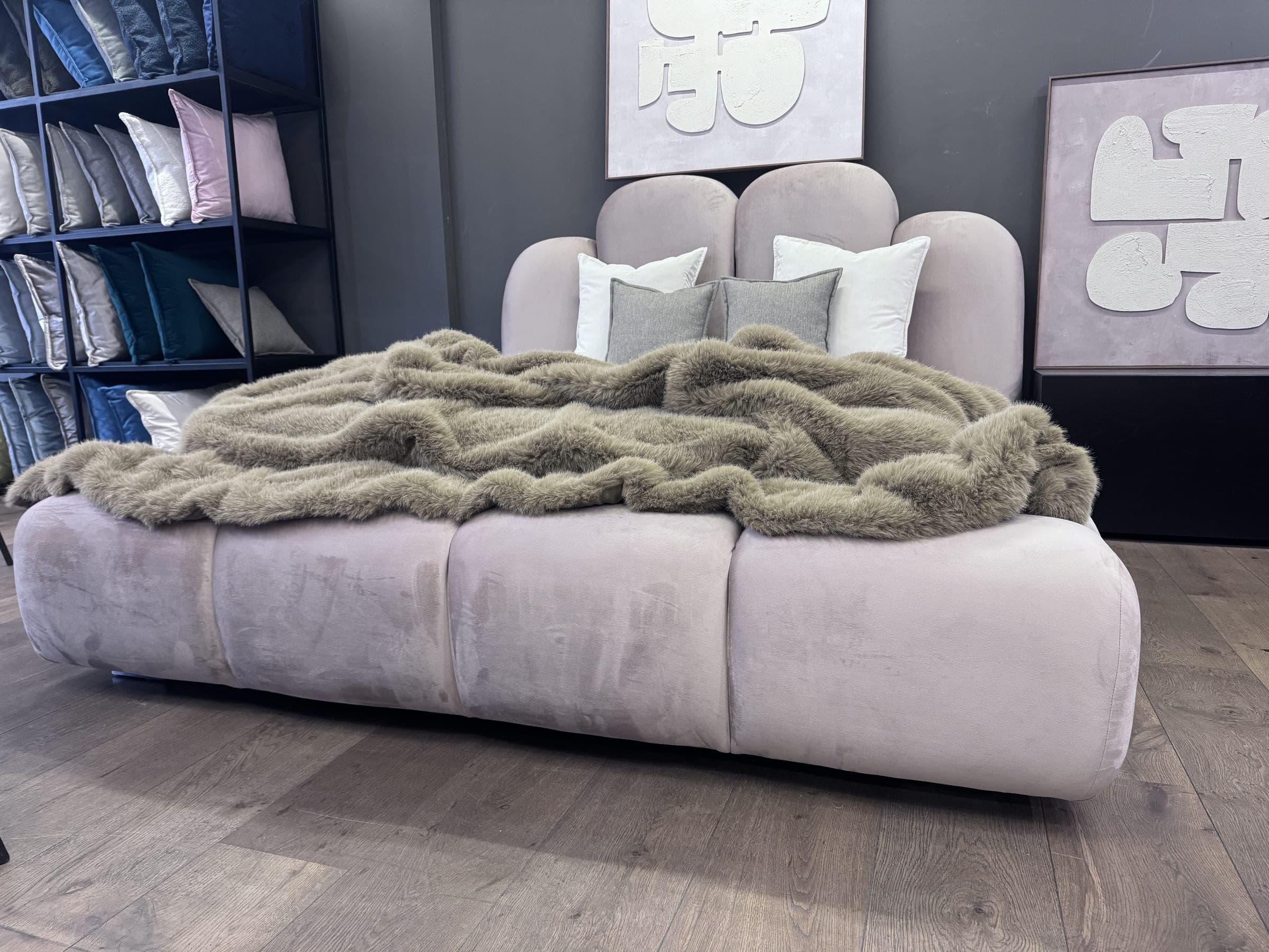 Textured throw over a blush velvet bed